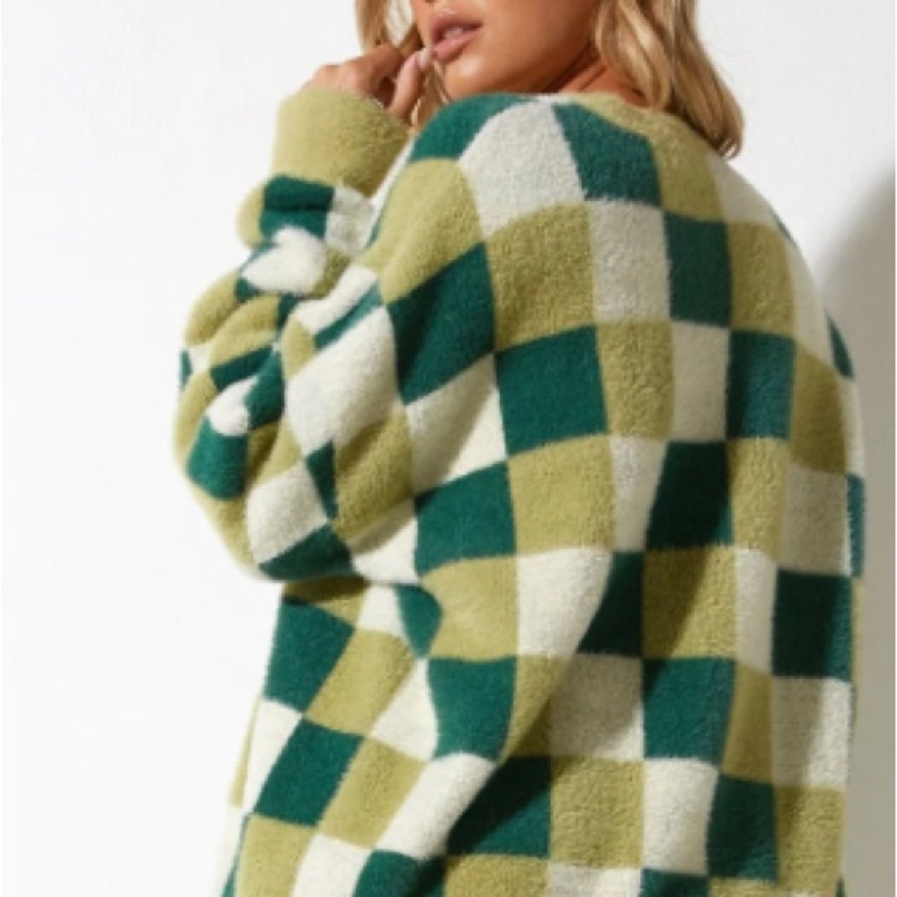 Sweater by Motel,S soft with loose fit. Long sleeves green and cream checkered!